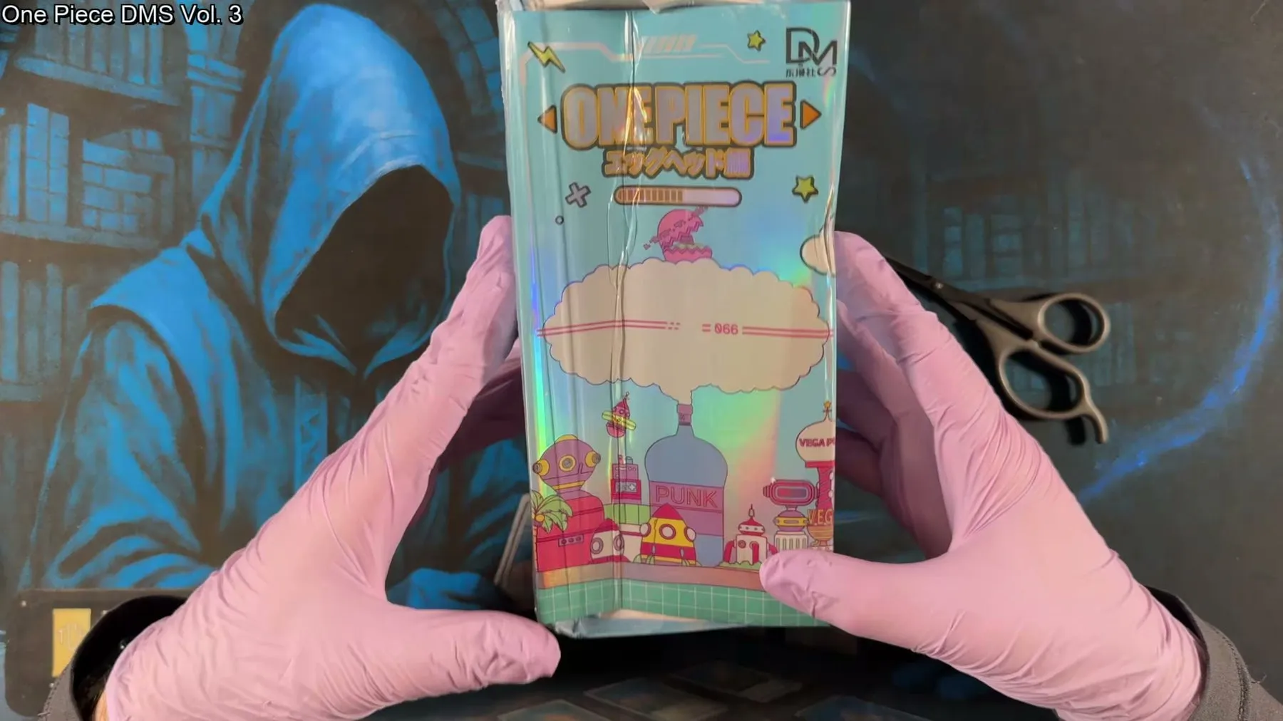 The One Piece DMS Vol. 3 box, thoroughly crushed in shipping, held up to camera.