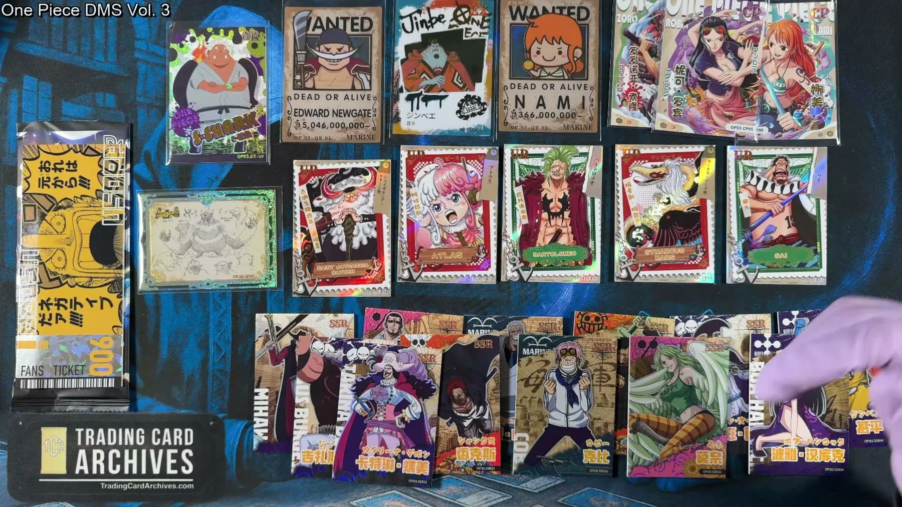 The complete One Piece DMS Vol. 3 haul laid out, including UR cards, SSRs, QR wanted posters and the sketch card.