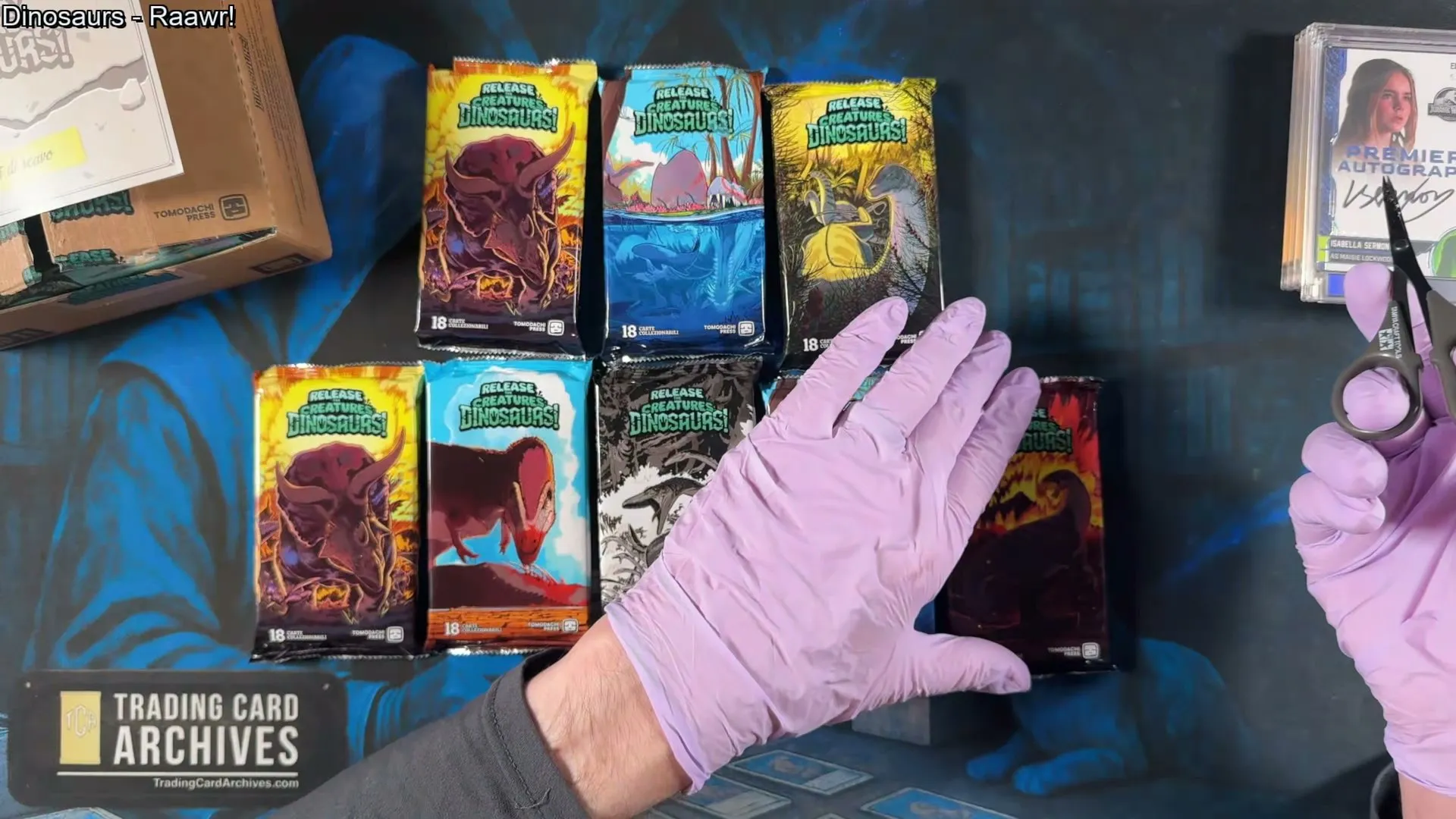 All eight Release the Creatures pack wrappers, each with different dinosaur artwork