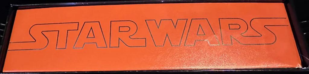 Side of the box of star wars pre release trading cards