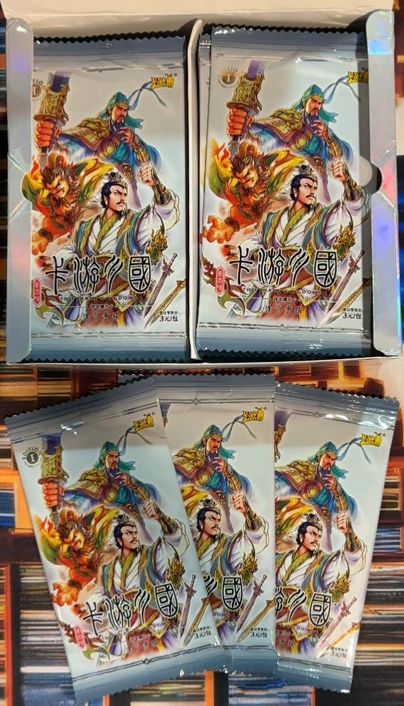 My box of Kayou Three Kingdoms TCG cards, open with 3 packs on display