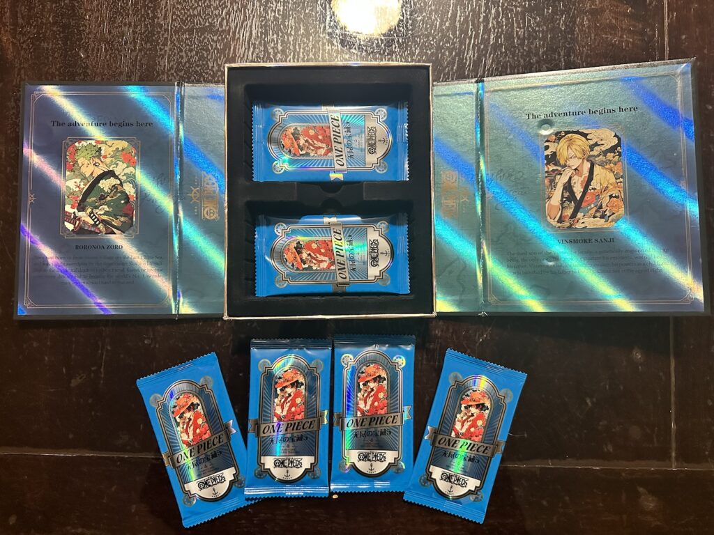 One Piece Endless Treasure set 5's box open showing the beautiful design work. There are 4 packs in front of it.